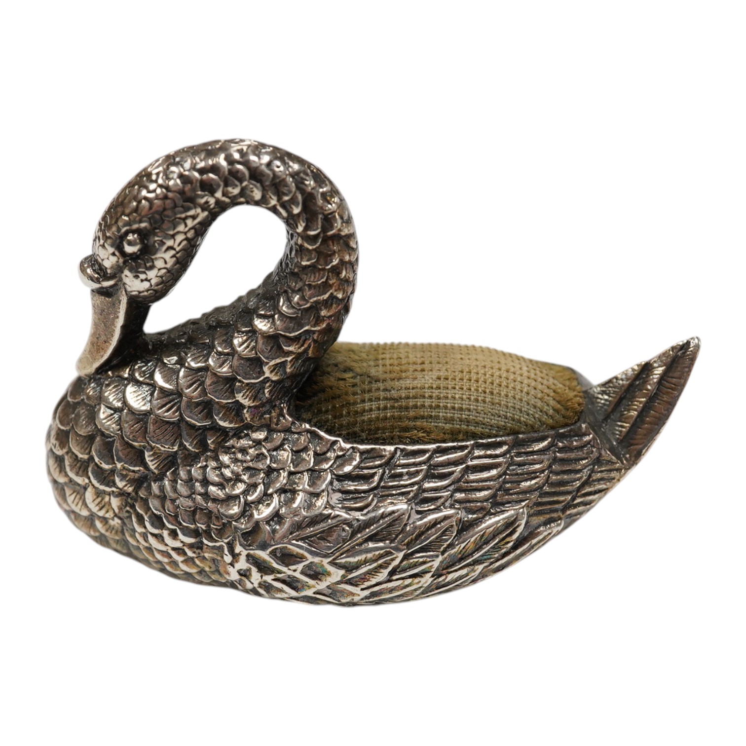 A modern silver mounted swan pin cushion, Ari D Norman, London, 1988, length 59mm. Condition - fair